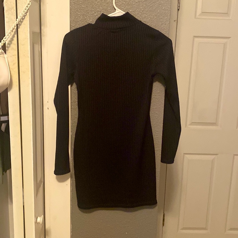 The black dress is a short but tight dress that is snug.